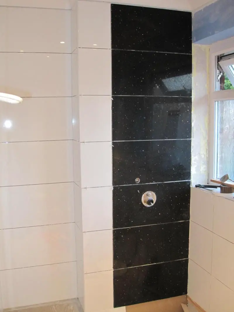 Fitting tiles over shower mixer