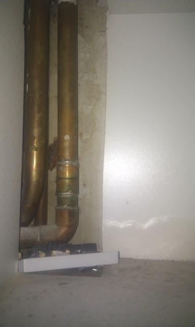 pipes in cupboard below boiler