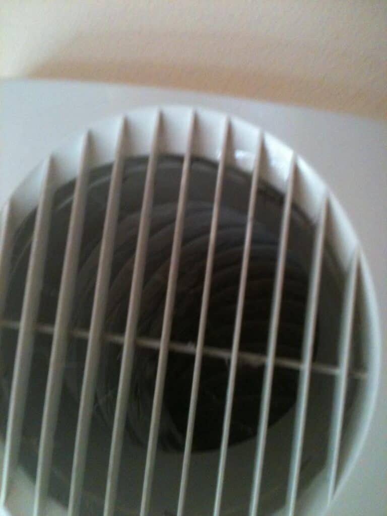 Bathroom extractor fan grille viewed from inside