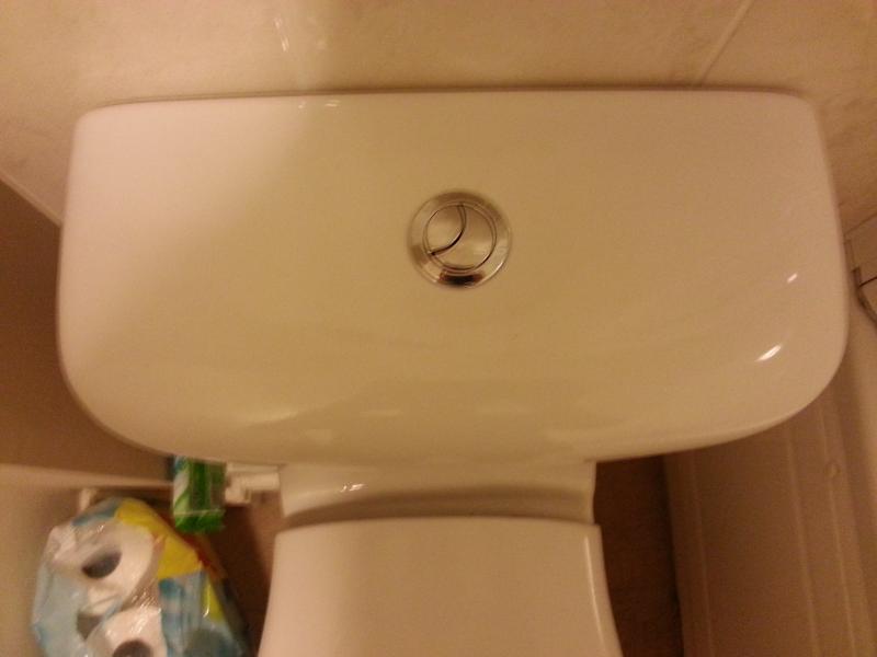 Ideal Standard cistern showing fill valve and push-button flush mechanism