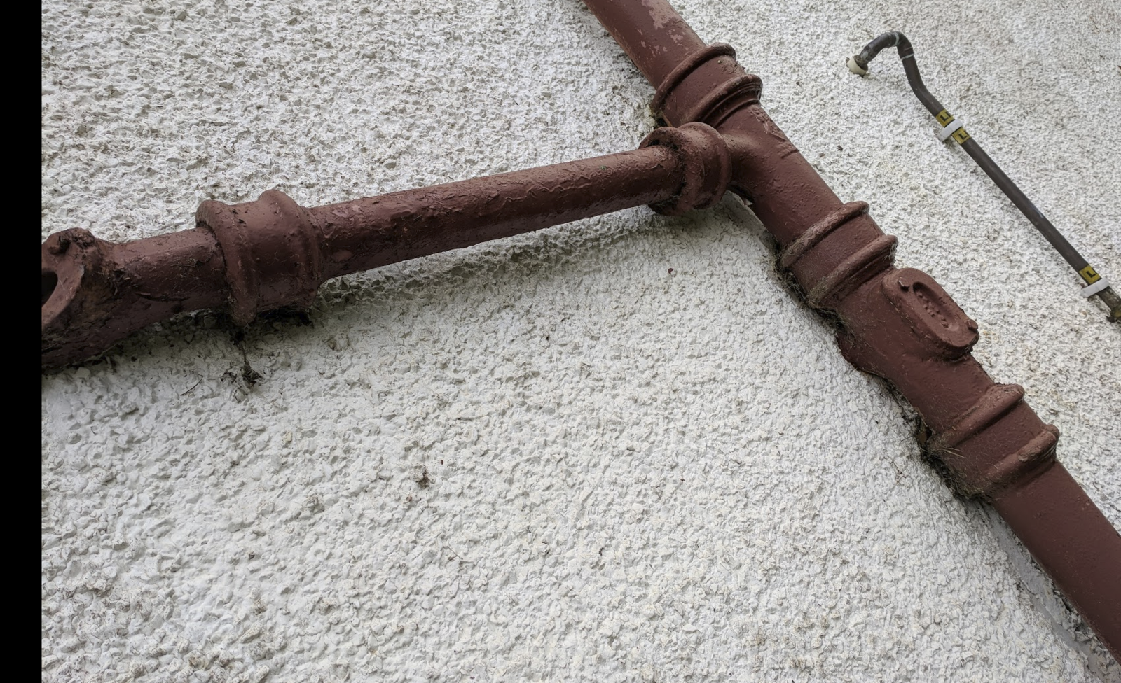 Rerouting external soil pipe, removing old cast pipes & joining into