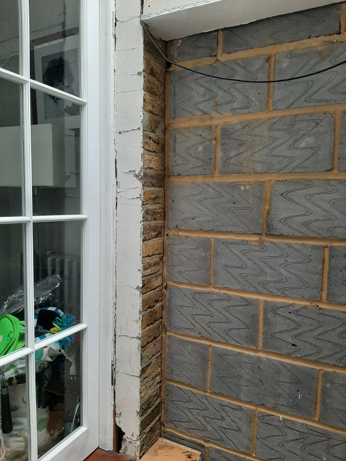 How should I plug gaps where new breeze block wall meets old bricks ...
