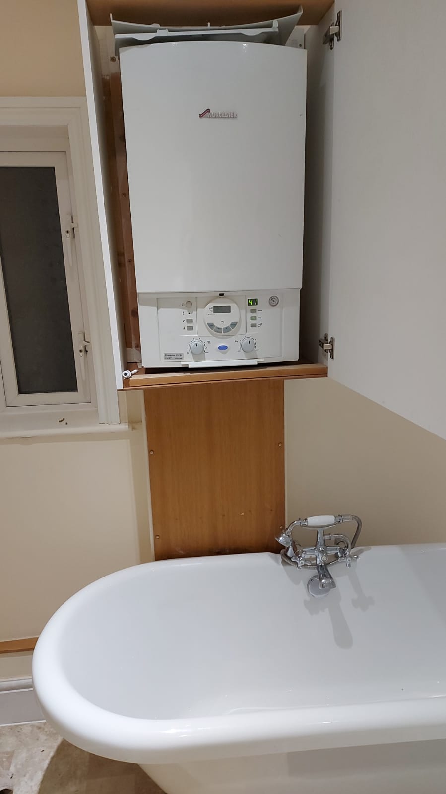 Combination Boiler sited directly over bath in rented property DIYnot
