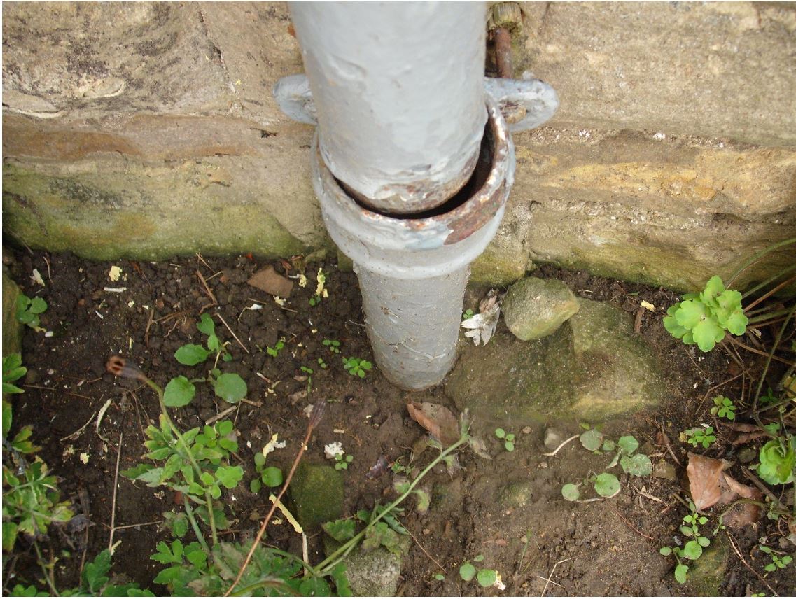 Downpipe after I sucked out the sediment but before excavating.JPG