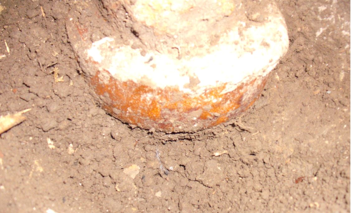 Downpipe connection with vitrified clay pipe socket close up.JPG