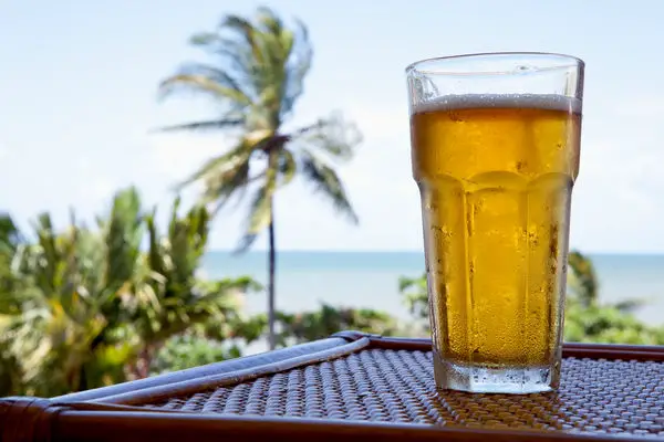 glass-cold-beer-table-view-beach-10164774.jpg