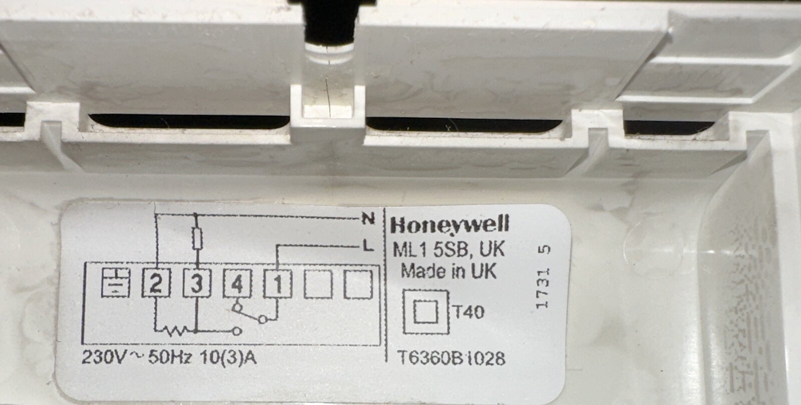 A sticker that is displaying the wiring diagram for the Honeywell thermostat
