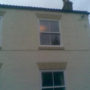 3 pictures of the window/damp