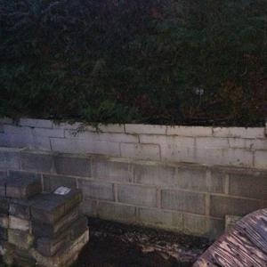 Collapsing retaining wall