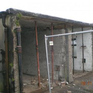 Putting new lintols in garages .