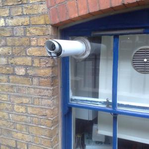 Flue through a glass window