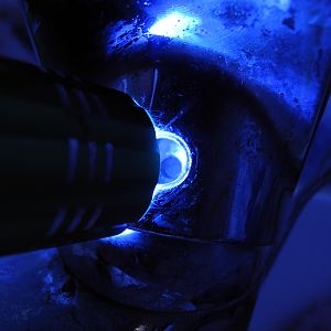 Shining a light into the hole in the tap head.