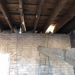 Pushed 140mm wools insulation between the joists above landing