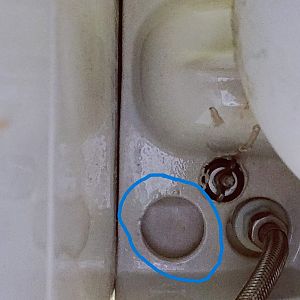 Blue circle shows where the water is leaking from