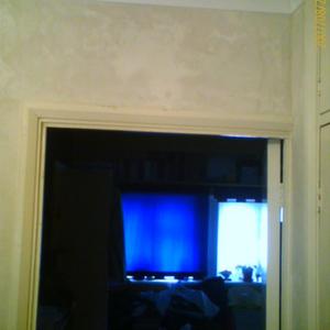 last doorway at top of stairs