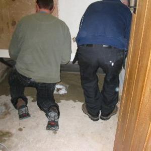 Lowering the tray into position.