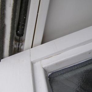 Bottom of sash window  tilted in