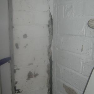 THE LOWER HALF OF THE CRACK NEAR BACK DOOR