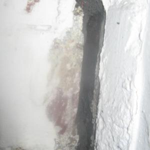 CLOSE UP OF CRACK NEAR BACK DOOR