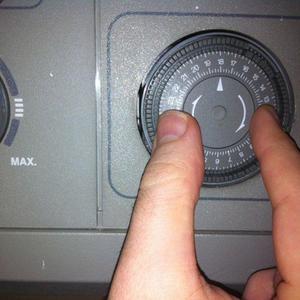 Turning outer dial to present time