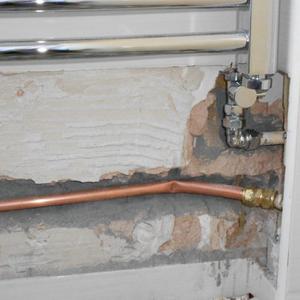 Tiles removed and chased the wall.