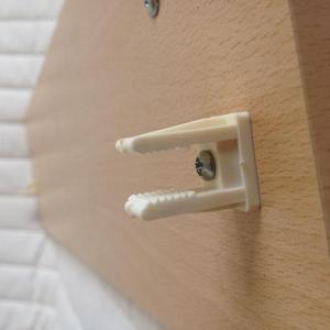 Clip on back of filler panel