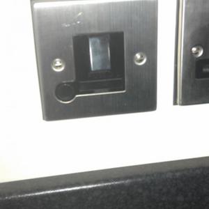 Counter level switched, fused spur for socket