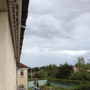 Dripping white pipe just below tiles