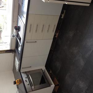 White gloss slab kitchen.