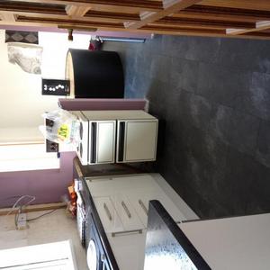 Slate effect laminate floor all the way through.