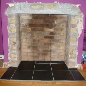 Slate hearth tiles.