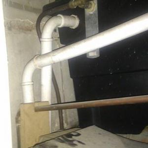 water tank pipework into cupboard