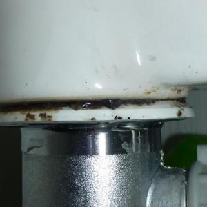 Pop-up basin waste leaking on underside