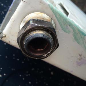 Lower left side of radiator