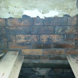 bare brick under bay window