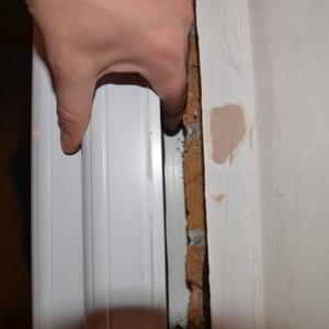 Fingers pushing external trim