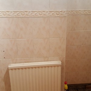 Radiator on chimney breast