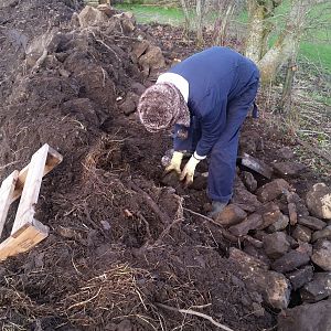Karen sorting stone from soil