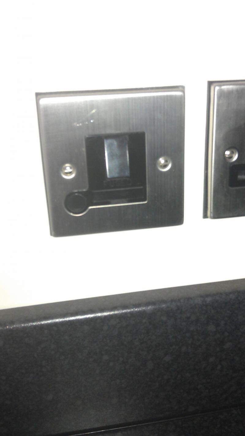 Counter level switched, fused spur for socket