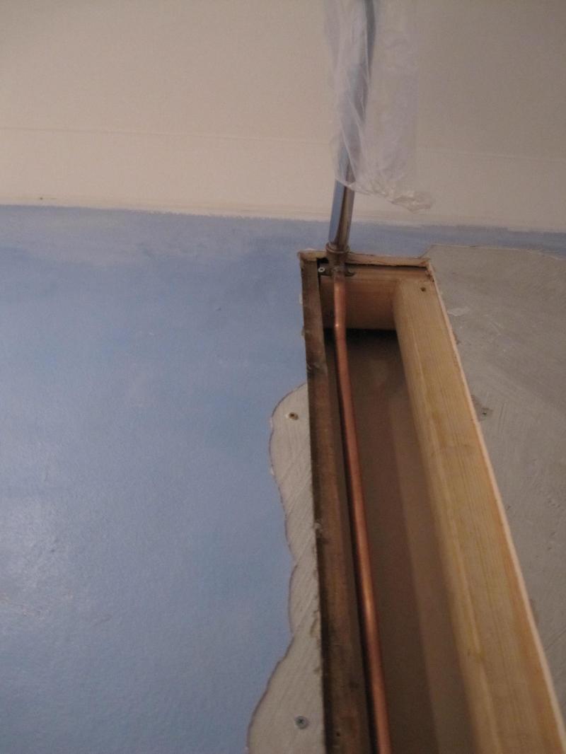 Cutting out the stud wall for main shower head