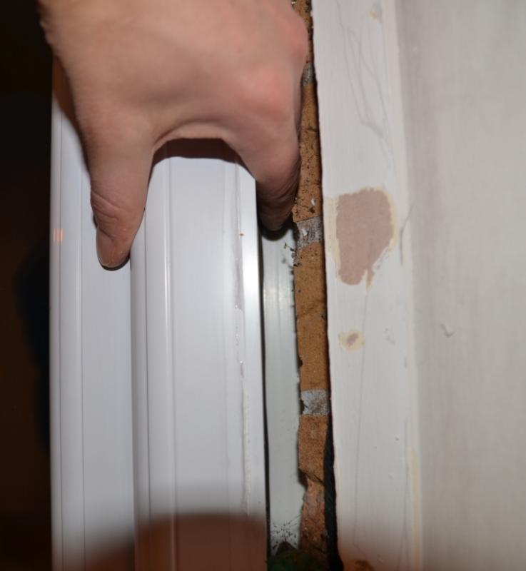 Fingers pushing external trim