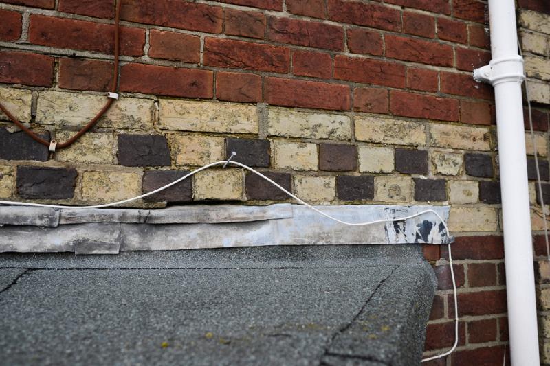 Flashing above the flat roof