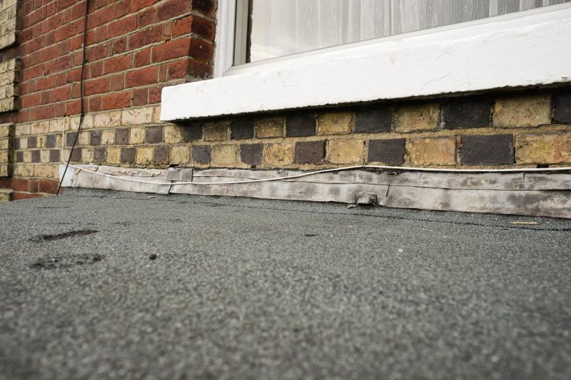 Flashing above the flat roof