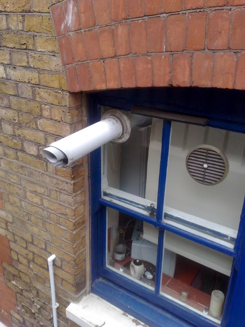 Flue through a glass window