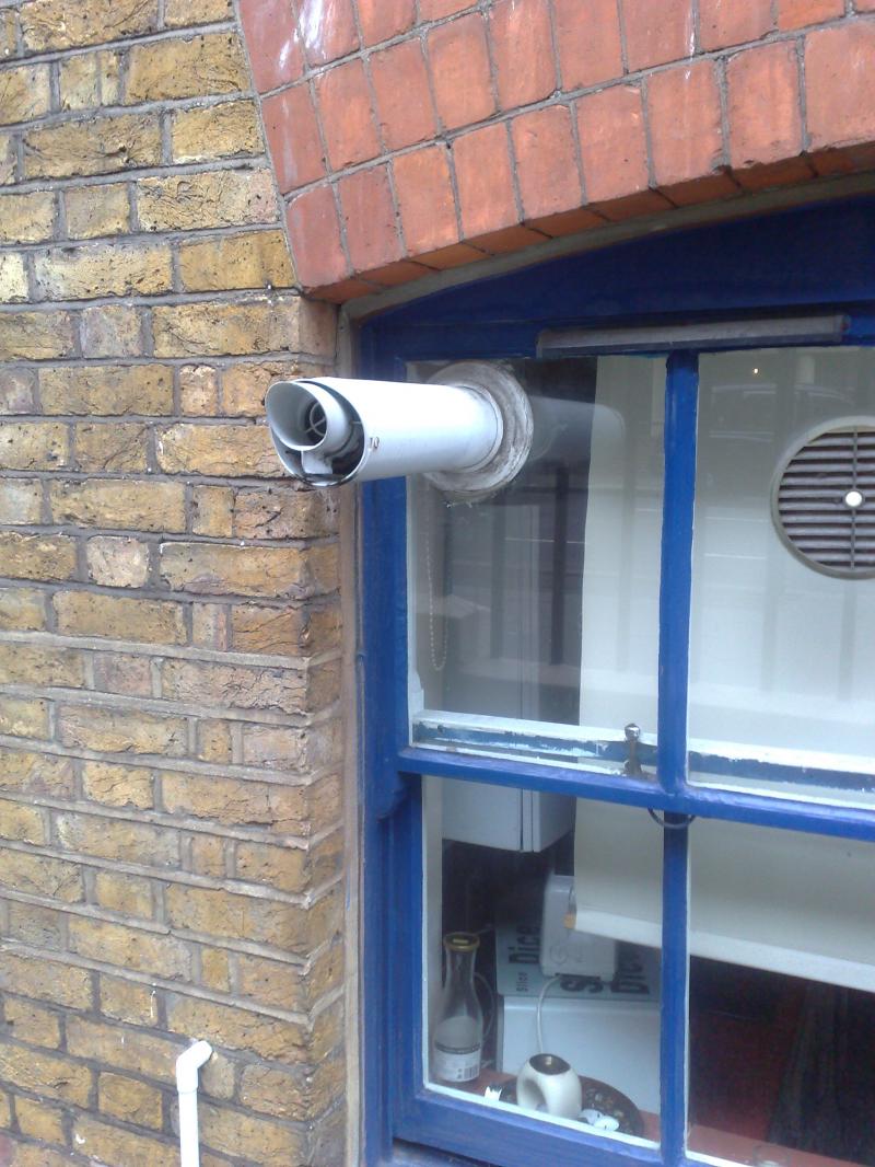 Flue through a glass window