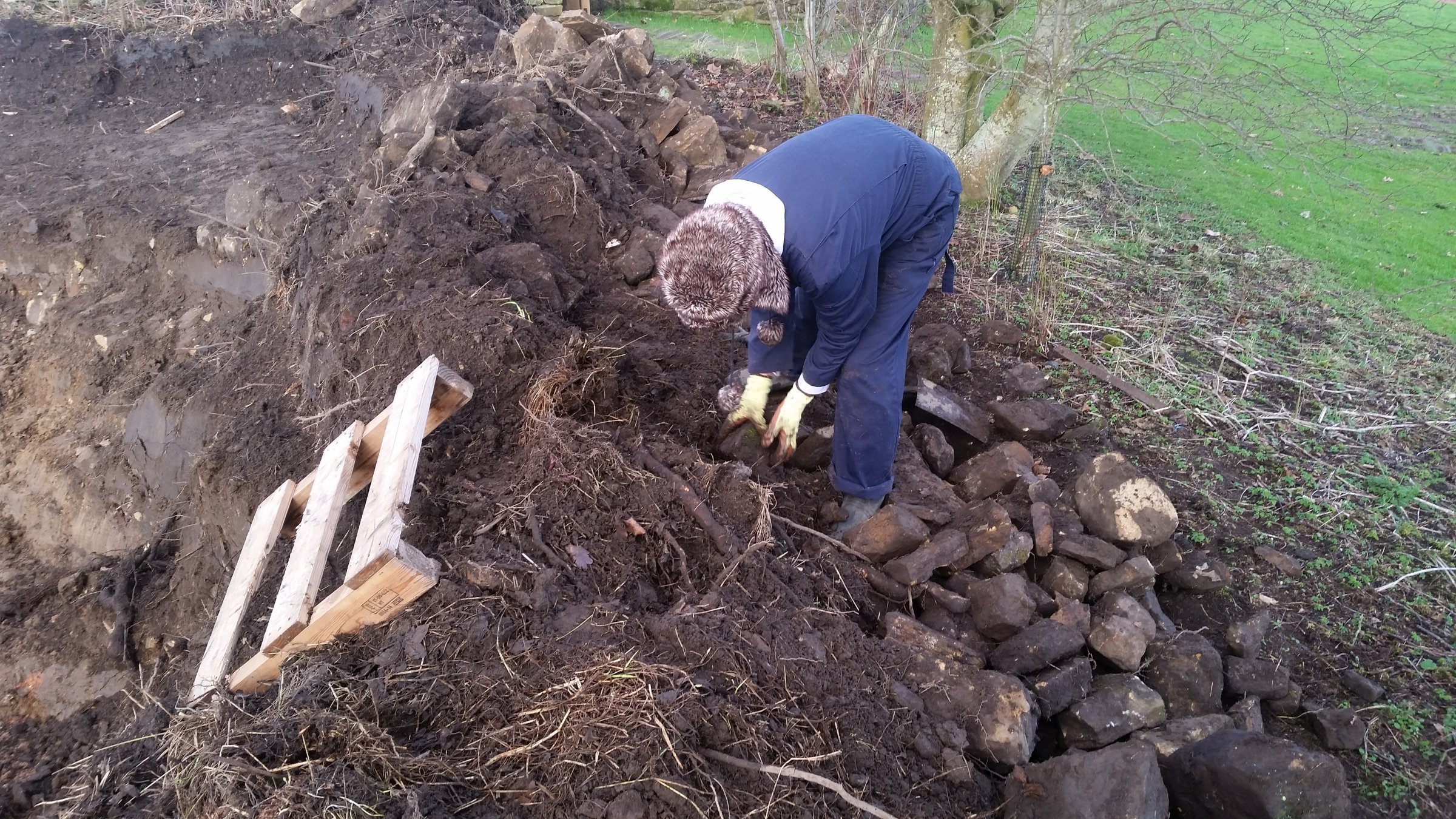 Karen sorting stone from soil