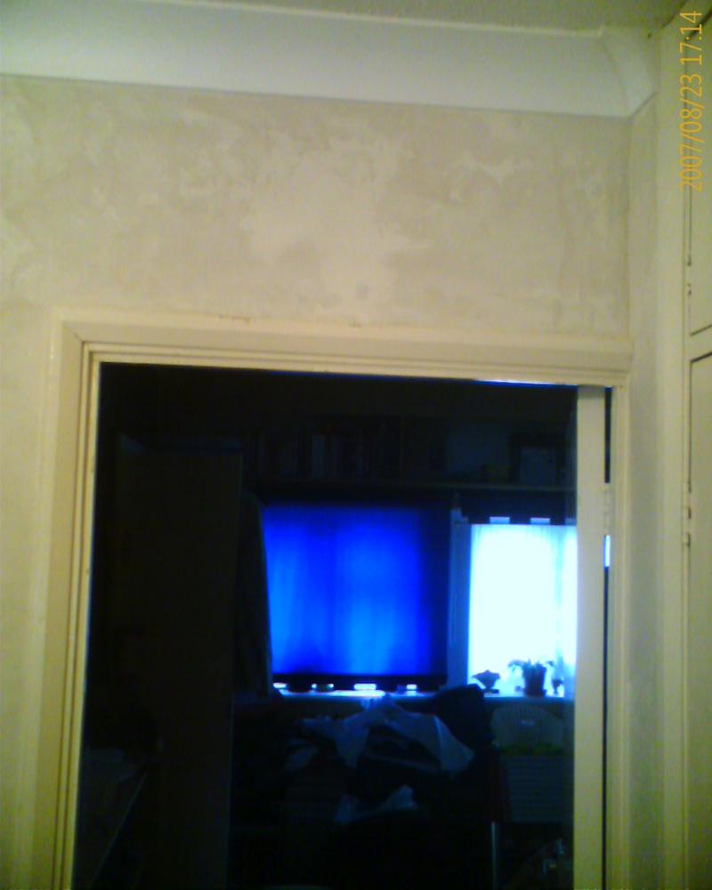 last doorway at top of stairs