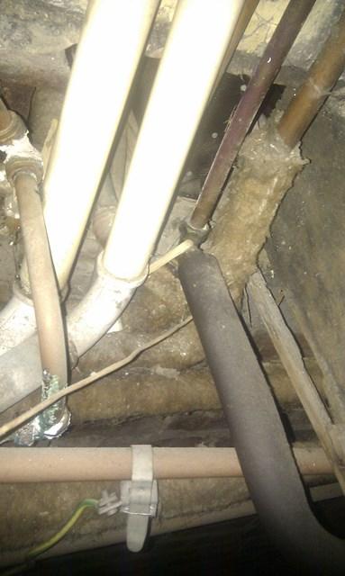 pipes from water tank under floor