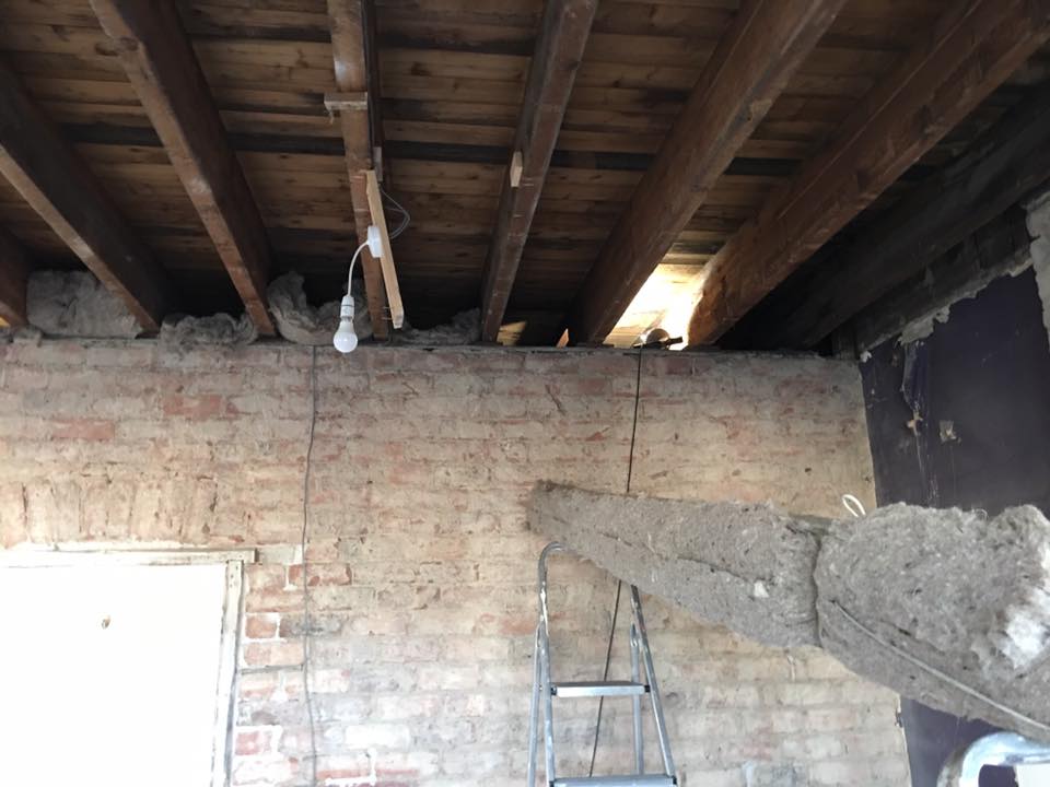 Pushed 140mm wools insulation between the joists above landing