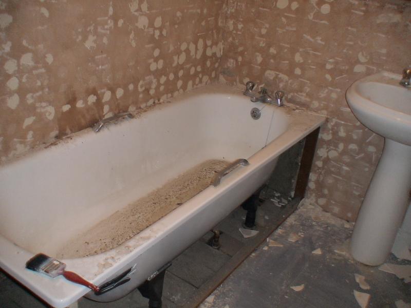 Taking the tiles and bath out